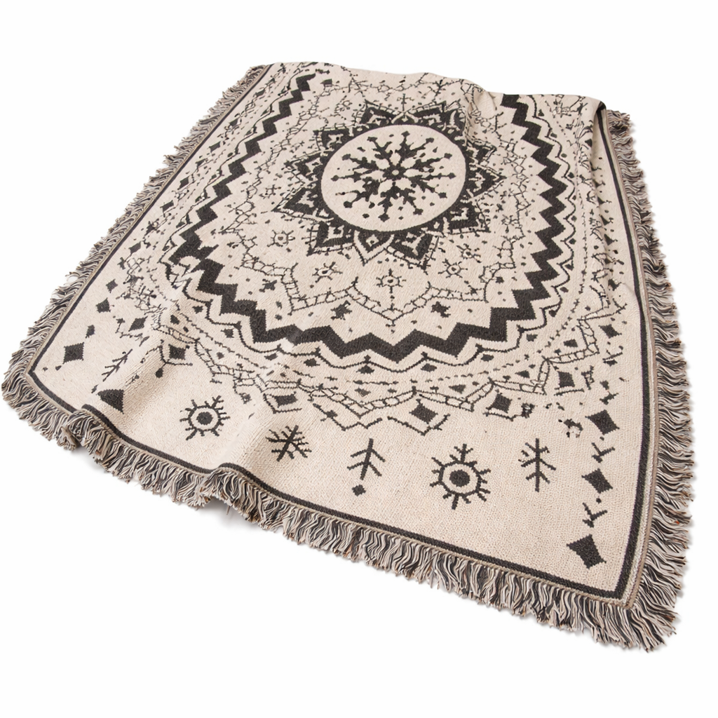 Mandala patterned throw blanket with fringes on a white background