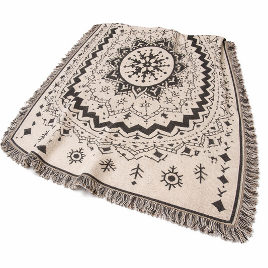 Mandala patterned throw blanket with fringes on a white background