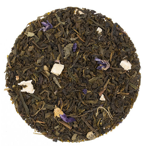 Tea leaves with visible flowers and petals on a white background