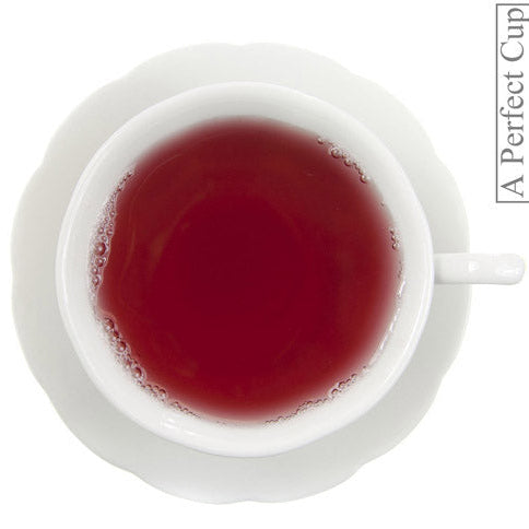 White cup with red liquid on a white background, featuring 'A Perfect Cup' branding.