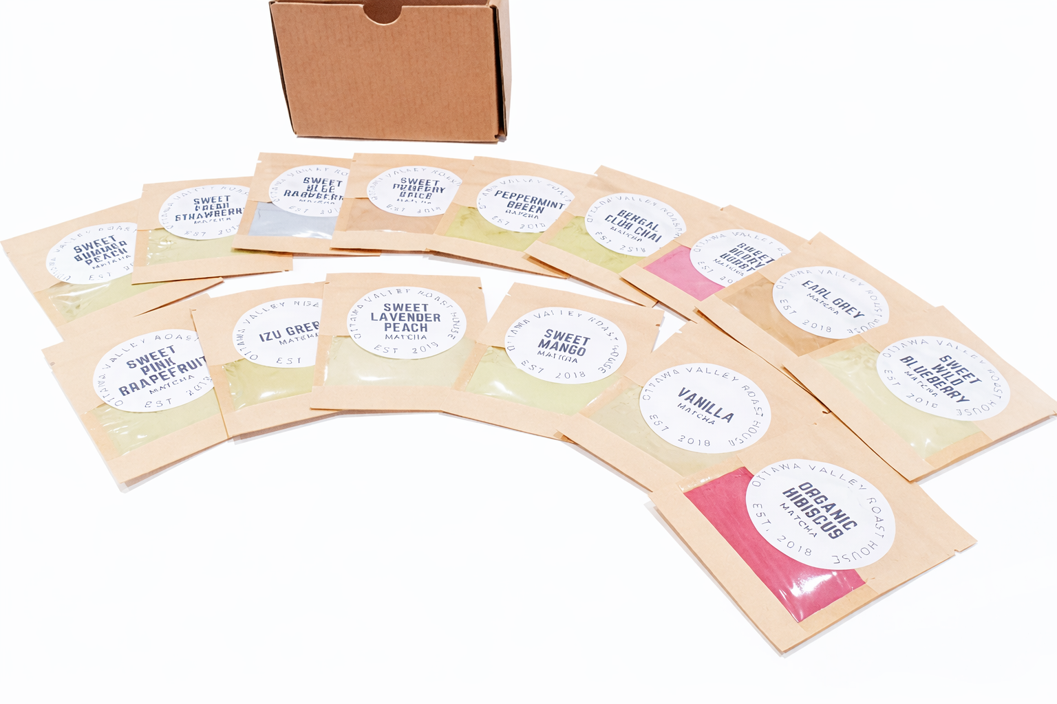 Set of organic roasted coffee packages with labels on a white background
